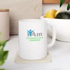 Bright white ceramic mug featuring the "I Am Cooperation & Harmony" logo, perfect for promoting unit.